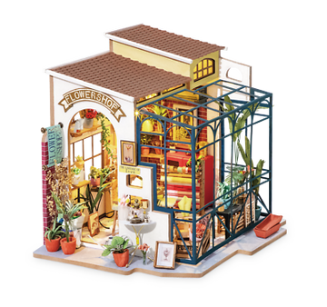 Emily's Flower Shop DIY Model Kit by Robotime, featuring a detailed miniature flower shop complete with vibrant plants, colorful interiors, and an inviting exterior. This DIY kit offers an engaging building experience for craft lovers, showcasing intricate design elements and a charming aesthetic.