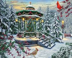 A festive jigsaw puzzle featuring a holiday gazebo adorned with lights and decorations, set in a snowy landscape. Tall evergreen trees and red cardinals add to the winter scene, creating a cozy and cheerful atmosphere.
