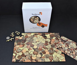 Bewilderness Coin Maze Wooden jigsaw puzzle featuring a richly detailed image of assorted coins. The puzzle includes 173 pieces in a geometric style, with a completed size of approximately 8 x 11 inches. The box packaging showcases the puzzle design along with a few loose puzzle pieces and a quarter for scale.