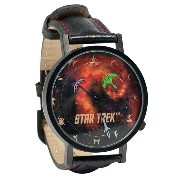 A stylish Klingon Watch designed by Unemployed Philosophers Guild. The watch features a vivid galaxy-themed dial with the 'Star Trek' logo, Klingon symbols, and a distinctive green Klingon insignia. It has a black faux leather strap with red stitching, combining sci-fi aesthetics with functional timekeeping.