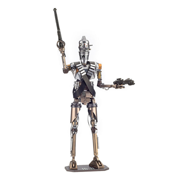 Metal Earth ICONX IG-11 figure made from metal parts, depicting a tall robotic character holding a weapon in one hand, standing on a base.