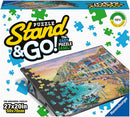 Puzzle Stand & Go! by Ravensburger is an innovative jigsaw puzzle easel designed to hold and display your puzzle, measuring 27x20 inches. The product features a vibrant image of a coastal scene, symbolizing both fun and relaxation. It is perfect for assembling horizontal puzzles, making it easier for puzzle enthusiasts to work on their projects while maintaining an organized workspace.