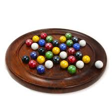 Large Solitaire game set by House of Marbles featuring a circular wooden board with colorful marbles displayed. The game is designed for strategic play and enhancing cognitive skills, offering a classic challenge for all ages.