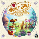 Honey Buzz game box featuring colorful artwork of animals including a bear, raccoon, and bees, set in a picturesque village scene with a honey jar and beehive. The title is prominently displayed at the top, emphasizing strategy and organic themes.