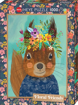 Heye 1000-piece jigsaw puzzle featuring a whimsical illustration of a smiling squirrel adorned with a colorful floral crown, set against a soft blue background. The puzzle box is decorated with vibrant floral patterns, highlighting the playful and artistic theme of 'Floral Friends' by Mia Charro.
