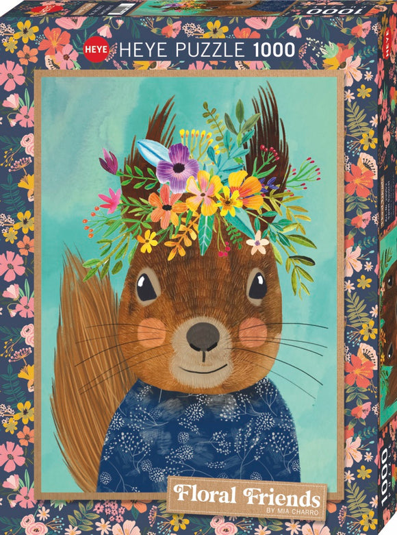 Heye 1000-piece jigsaw puzzle featuring a whimsical illustration of a smiling squirrel adorned with a colorful floral crown, set against a soft blue background. The puzzle box is decorated with vibrant floral patterns, highlighting the playful and artistic theme of 'Floral Friends' by Mia Charro.