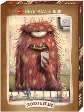A jigsaw puzzle titled "Selfie Zozoville" produced by Heye, featuring a whimsical, furry monster with one large eye taking a selfie in a bathroom setting. The background includes humorous graffiti and a sink with various items, creating a playful and artistic vibe. The puzzle contains 1000 pieces and showcases quirky art that adds a fun challenge for puzzle enthusiasts.