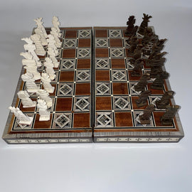 A 14-inch folding chess set featuring intricately designed pieces in two contrasting colors. The board showcases a fine wood finish with decorative inlays, ideal for both collectors and casual players. The set is compact and portable, perfect for travel and storage.