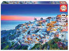 Educa SANTORINI jigsaw puzzle featuring a stunning view of the iconic white buildings and blue domes of Santorini at sunset, with 1500 intricately designed pieces. Perfect for puzzle enthusiasts and as a decorative artwork once completed.