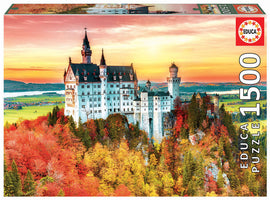 A beautifully packaged jigsaw puzzle titled 'AUTUMN IN NEUSCHWANSTEIN' by Educa. The image on the box features Neuschwanstein Castle surrounded by vibrant autumn foliage, with a scenic landscape of rolling hills and a lake in the background. The puzzle consists of 1500 pieces.