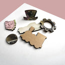 An assortment of jigsaw puzzle pieces from the '20th Century Transport' jigsaw puzzle by Trove. The pieces include shapes of a train, a gear, and a state map, showcasing detailed patterns and vibrant colors.