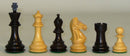 A display of black and boxwood chess pieces, each measuring 3.75 inches high. The set includes a black king and queen, a boxwood king and queen, a black knight, a boxwood rook, and a boxwood pawn, all exquisitely crafted with a classic design and double weighting for stability during play.
