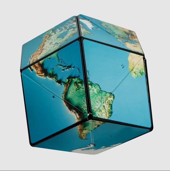 Shashibo Earth by Geobenders is a mechanical puzzle shaped like a cube, featuring a beautifully detailed map of the Earth with vibrant colors representing continents and oceans. This unique puzzle offers an engaging and tactile experience, encouraging problem-solving and creativity as users manipulate its geometric design.