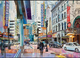 A vibrant jigsaw puzzle image titled 'Paramount Reflected' by Art & Fable Puzzle Co, showcasing a bustling city street scene. The artwork features tall buildings adorned with neon signs, including the prominent 'Paramount' marquee, and lively street activity with pedestrians and vehicles navigating the colorful scene.