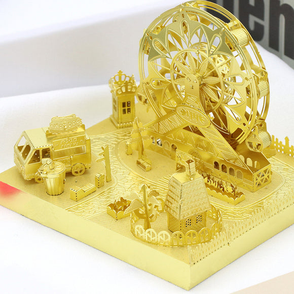Intricately designed DIY model of a Ferris Wheel by Mu Model, featuring a golden finish. The scene includes a food truck, small houses, trees, and decorative elements set on a detailed base, perfect for collectors and craft enthusiasts.
