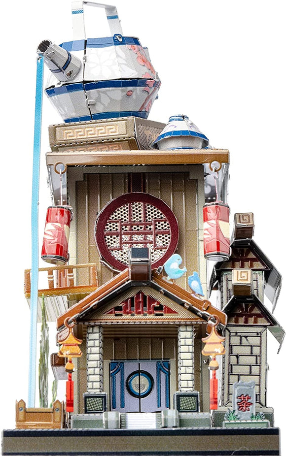 The Travel the World Tea House, a detailed DIY kit by Mu Model, showcases intricate architectural elements resembling a traditional tea house with multiple roofs, hanging lanterns, and decorative panels. This creative model features vibrant colors, a tea pot on top, and delicate designs, making it an eye-catching piece for any crafting enthusiast.