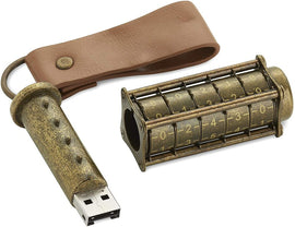 Cryptix Original 16 GB USB drive featuring a mechanical puzzle design with a vintage brass finish. The USB has a cylindrical shape with rotating dials displaying numbers and a leather strap attached for easy carrying.