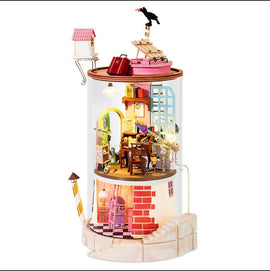 Robotime Secluded Neighbor DIY Model Kit featuring a whimsical, intricately designed miniature house with multiple rooms, detailed furnishings, and a playful crow on the roof. The model includes elements like a study with a desk, a small ladder, and a decorative exterior, all enclosed in a clear display that highlights its charm.