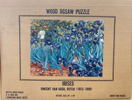 Irises jigsaw puzzle featuring Vincent van Gogh's famous painting of vibrant blue irises set against a colorful background. The puzzle, made of wood, contains approximately 400 pieces and measures 14" x 18". The design showcases Van Gogh's unique brushwork and vivid colors, inviting art lovers and puzzle enthusiasts to enjoy a creative and relaxing experience.
