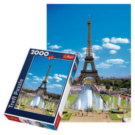 A 2000-piece jigsaw puzzle by Trefl featuring a vibrant image of the Eiffel Tower in Paris. The packaging displays the puzzle layout with clear colors, showcasing the iconic structure and surrounding fountains under a bright blue sky.