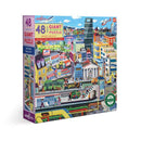 Box of the Eeboo Within the City jigsaw puzzle, featuring colorful artwork of a lively city scene with buildings, people, and transportation. Includes 48 giant pieces and an informational poster.