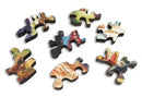 A selection of colorful wooden jigsaw puzzle pieces from the Dragon Mountain jigsaw puzzle by Bryn Barnard, made by Artifact Wooden Puzzles. The pieces feature vibrant, abstract designs with varying colors and shapes, showcasing the intricate craftsmanship of the puzzle.