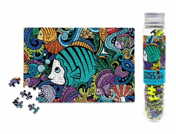 Image of the Fish Doodle Micropuzzle 150pc by Micro Puzzle. The puzzle features a colorful underwater scene with various fish and sea life. It includes loose pieces alongside the completed puzzle image on a vibrant blue and multi-colored background.