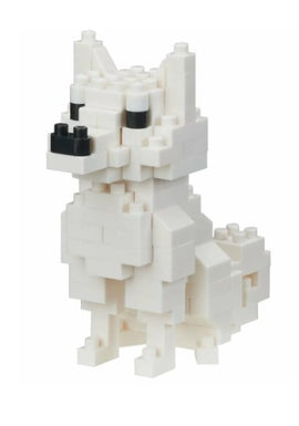 A detailed representation of the Nanoblock Hokkaido Dog DIY kit, showcasing a white block dog with black features, created from small interlocking pieces. The sculpture stands upright, emphasizing the craftsmanship and creativity involved in building this model.