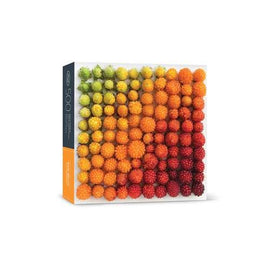 A colorful jigsaw puzzle featuring a vibrant pattern of salmonberries in various shades, arranged in a gradient from green to red. The puzzle box is labeled with the number 500, indicating the total pieces. The design showcases an array of textured, round berries, making it an appealing and engaging puzzle for enthusiasts.