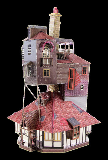 A detailed Metal Earth DIY kit of a whimsical building titled 'The Burrow'. The model features intricate designs, vibrant colors, and various roof styles, showcasing a multi-level structure with windows, balconies, and a chimney. Ideal for model enthusiasts and creative hobbyists.
