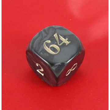 A close-up image of a Doubling Cube for Backgammon, designed by Koplow Games. The cube is black with gold numbers displaying 2, 8, 64, and an infinity symbol, placed against a bright red background. This cube is used in Backgammon to indicate the stakes of the game.