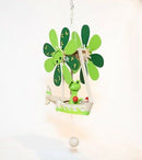 A whimsical Wupper Frog Boat hanging ornament featuring a cheerful frog pilot, green flower-shaped propellers, and a charming boat design. The decoration is made of colorful wood, perfect for adding a playful touch to any space.