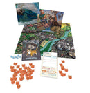 A tabletop game set titled 'Magical Kitties Save the Day!' by Atlas Games. The image features a colorful game board depicting a city map, along with assorted game pieces, including cat tokens, dice, and two adventure booklets titled 'The Big Adventure' and 'River City.' A rulebook is also displayed, alongside a player sheet for tracking game progress.