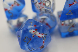 A vibrant Koi Pond RPG Dice Set featuring translucent blue dice with colorful koi fish designs inside, showcasing various numbers in elegant gold printing. The set includes multiple dice shapes designed for role-playing games, perfect for adding a unique touch to any gaming session.
