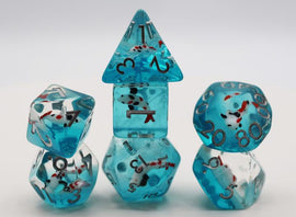 A colorful Water Garden Koi RPG Dice Set featuring translucent aqua dice with detailed koi fish embedded inside. The set includes various polyhedral dice, such as a pyramid, cube, and dodecahedron, each marked with numbers and striking red accents, ideal for tabletop gaming.