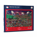 Boston Red Sox jigsaw puzzle from White Mountain Puzzles featuring a vibrant scene of a baseball game at Fenway Park. The puzzle contains 500 pieces and measures 24 x 18 inches, showcasing a lively crowd and detailed imagery of stadium elements and fan activities.