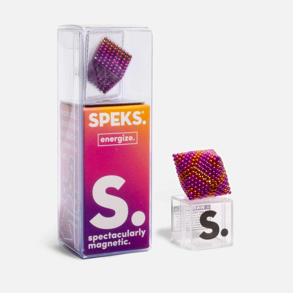 The Speks Energize Gradient is a collection of colorful magnetic beads displayed in a transparent box. A vibrant purple, orange, and pink spherical shape is featured, showcasing the product's fun and imaginative potential for creating various designs.