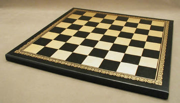 A stylish 13-inch pressed black and gold leather chess board featuring a classic checkered design with ornate golden detailing along the edges, enhancing its elegant look and feel.