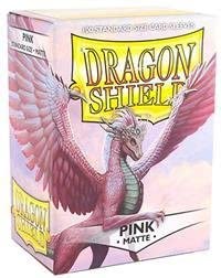 A package of Dragon Shields in Matte Pink. The box features a vibrant illustration of a pink dragon with wings spread wide, symbolizing protection for gaming cards. This product contains 100 high-quality protective sleeves designed to keep cards safe during play.