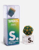 Speks Inspire Gradient product featuring a magnetic building toy in a clear plastic case. The kit includes colorful magnetic pieces that can be assembled into various shapes, promoting creativity and cognitive skills. The packaging displays a gradient design from green to yellow, with the text 'SPEKS. inspire. Spectacularly magnetic.' clearly visible.
