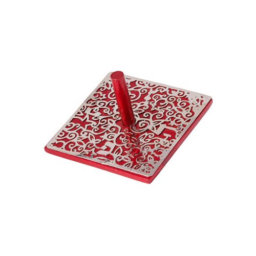 A vibrant red dreidel with an intricate laser-cut top design. The dreidel features ornate patterns that enhance its decorative appeal, making it perfect for game play and festive occasions.