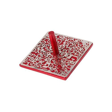 A vibrant red dreidel with an intricate laser-cut top design. The dreidel features ornate patterns that enhance its decorative appeal, making it perfect for game play and festive occasions.