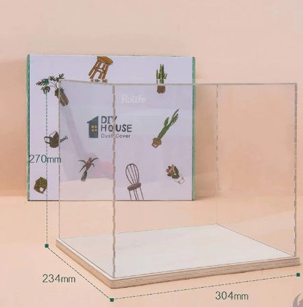 A clear acrylic cover designed to protect and showcase DIY projects. The cover is displayed with dimensions labeled, featuring a sleek, modern design suitable for various uses, including as a display case for houseplants or decorative items. The background includes the product packaging with illustrations of plants and furniture, emphasizing its utility in home decor.
