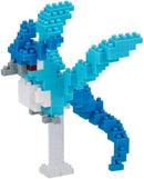 Nanoblock Articuno DIY kit showcasing a blue and white block structure resembling the character. Features detailed design with a distinct tail and wings, standing on a clear base.