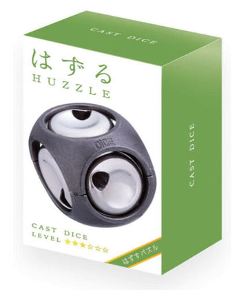 A close-up view of the Cast Dice mechanical puzzle by Hanayama. The puzzle features a sleek black design with shiny spherical elements. The packaging is vibrant green and white, displaying the product name 'CAST DICE' prominently on the front, along with a Japanese character that adds an artistic touch. The puzzle encourages problem-solving and is ideal for both beginners and experienced puzzlers.