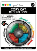 The Copy Cat Memory Game by Playmaker is a fun and engaging game designed for ages 6 and up. It features a circular device with four colored lights (red, green, yellow, blue) and a central button. Players must repeat the light sequences in order to win, testing their memory and concentration skills. The packaging includes clear warnings about small parts, indicating it is not suitable for children under three years old.