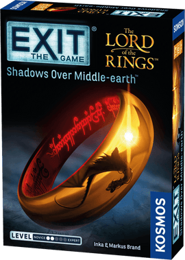 The Exit: The Lord of the Rings Shadows Over Middle-earth board game by Thames & Kosmos. The box features a prominent image of the One Ring, engraved with elvish script, set against a dark background. The game's title is displayed prominently at the top, with the Exit logo and additional branding details on the sides. It is designed for novice to expert players, combining adventure and puzzle-solving elements.