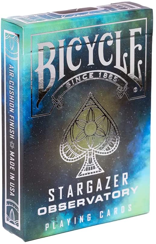 Bicycle Stargazer Observatory playing cards box featuring a vibrant design with a blue and green cosmic theme, highlighting the iconic spade symbol and 'Air-Cushion Finish' text, made by US Playing Card Co.