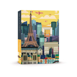 Jigsaw puzzle box featuring a colorful illustration of Paris with iconic landmarks like the Eiffel Tower and the Arc de Triomphe against a vibrant city skyline and sunset. The puzzle contains 1000 pieces and comes in a stylish, sturdy box.