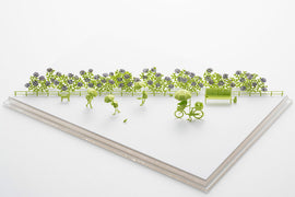 A vibrant and intricate model titled 'Rainy Season' by TERADA MOKEI, featuring miniature figures with umbrellas, a bicycle, and colorful flowers. The scene captures a park-like setting, perfect for DIY enthusiasts who enjoy crafting unique displays.